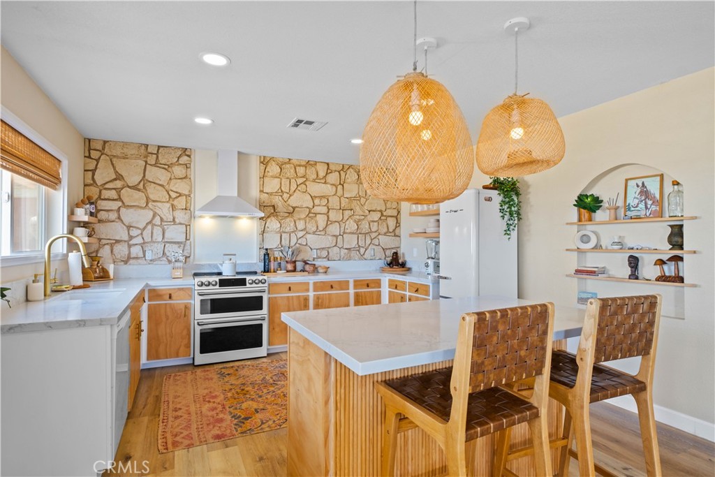 Discover the enchantment of the desert with the "Moonstone Adobe," a 2-bedroom, 1-bathroom haven nestled on 2.5 acres of serene Landers landscape at 1388 Fortuna Ave. This mystical retreat not only offers tranquility to those seeking a vacation home but also presents a lucrative investment opportunity, boasting up to 80% occupancy and a guest favorite.
Seller is offering a 2-1 seller paid buy down lowing the interest rate to 4.5% the first year and 5.5% the second year lender offering to refinance at no charge if rates go down sooner.
Recently remodeled to perfection, every inch of this desert gem has been thoughtfully orchestrated to blend luxury with comfort. Take note of the new luxury bamboo flooring that flows throughout the house, a smart thermostat ensures your comfort year-round and admire the high-end window shutters that frame breathtaking mountain views. The custom-built fireplace in the private courtyard adds warmth to cool desert nights under a canopy of stars.
The heart of the home features a natural stone vessel sink, adding a touch of desert elegance. Outside, the private courtyard, with its antique double door entrance, invites you to unwind in the enclosed hot tub that ensures both privacy and relaxation. A solar-powered gate opens to reveal a 2-car garage with laundry and a fully fenced yard that offers ample space for expansion or personalization.
With local attractions like La Copine's world-renowned cuisine, the Integratron's supernatural experiences, and nearby hiking in Joshua Tree, "Moonstone Adobe" is more than a home—it's a lifestyle. Entertainment at Giant Rock Meeting Room and discoveries at Moon Wind Trading Company are just a short drive away, while Pioneertown hosts concerts and film festivals for the culturally inclined.
This is a must-see property. The features and upgrades are too numerous to list, making 1388 Fortuna Ave an irresistible escape into a desert paradise.