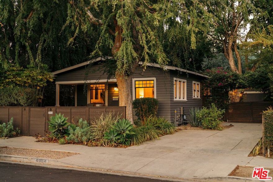 There's something magical about 4984 Vincent Avenue--from the moment you arrive, this storybook Craftsman on one of Eagle Rock's most desirable cul-de-sac streets welcomes you with the kind of timeless elegance that only a century of history can create. Past the picturesque front porch, find yourself in a living room and dining room where sunlight streams from picture windows onto original hardwood floors. The spacious kitchen is a showstopper that serves as the heart of the home, featuring custom cabinetry with paneled refrigerator, gleaming butcher block countertops, artistic tiling, professional-grade Wolf oven/range, and a charming Dutch door that opens to the garden beyond. The primary bedroom is a serene retreat with custom closet, French doors, and a newly renovated spa-like ensuite bath boasting dual rainfall + handheld shower heads and a bespoke vanity. Two additional bedrooms share a skylit bathroom with a clawfoot tub that feels straight out of a fairy tale. Every detail has been thoughtfully curated--from the reading nook accentuated by vertical statement windows to the built-in shelving offering additional storage throughout. Out back, discover a professionally designed garden sanctuary, lush with native plants, mature trees, tranquil fountain, and inviting patio and fire pit areas. Unwind after a long day on the deck outside your bedroom, enjoy dining al fresco with friends under twinkling lights, or explore the possibility of an ADU in the detached 2-car garage, entirely rebuilt in 2005. Located in the coveted Dahlia Heights Elementary School district and just a few blocks from Trader Joe's, Little Beast, Casa Bianca, and more, the home makes you feel like you're a world away--where kids ride their bikes on the street outside--while offering unparalleled urban convenience. 4984 Vincent is a once-in-a-blue-moon gem that seamlessly balances timeless craftsmanship and chic sophistication--don't miss your opportunity for a home that captures the heart of old Los Angeles, beautifully reimagined for modern life.