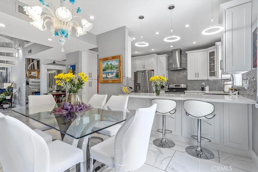 Introducing a completely remodeled 2-bed/2-bath top floor penthouse end unit condo with nearly 2,000 sq ft of impeccably designed living space!  Tucked inside a resort-style community in Encino, this updated stunner  is the ultimate entertainer paradise.



Step into a pristine open floorplan living room with soaring 20-foot ceilings,abundant natural light, fireplace, and a seamless indoor/outdoor flow. The stunning kitchen is outfitted with stainless steel appliances adjacent to a spacious dining area .  With in unit washer/dryer, recessed lighting,  two balconies,  upstairs loft, AND private rooftop deck.... this ideal property is the definition of everyday convenience and versatility.



The primary bedroom features a large walk-in closet, private balcony, dual vanity sinks, and modern shower with waterfall showerheads. 



The upstairs loft is suitable for an extra bedroom or private office space.  Adjacent to the loft is a private rooftop deck with breathtaking mountain views of Los Angeles — your personal slice of SoCal paradise.



Additional amenities at the Encino Spa South Community  include a sparkling pool, jacuzzi, sauna, fitness center, and a tranquil courtyard—all just footsteps away from Ventura Blvd, the 101 freeway, and some of Encino’s best shopping and dining. HOA covers earthquake insurance, water and trash.  



Unit also provides FOUR PARKING SPACES inside the garage, in addition to plenty of guest parking also. 



Don’t miss this rare blend of size, style, and location in a beautiful neighborhood of Encino!