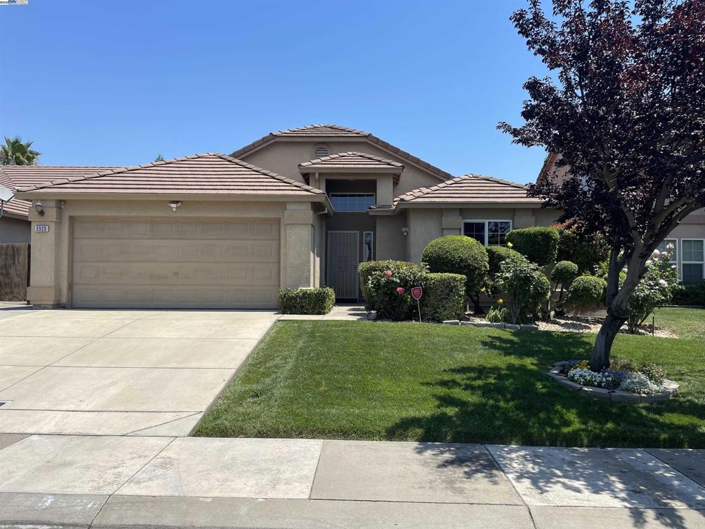This well-maintained home has been lovingly cared for by the original owner since it was built. The spacious, open floor plan is flooded with natural light, creating a warm and inviting atmosphere throughout. The kitchen, recently remodeled just a year ago, is a chef's dream—featuring sleek stainless steel appliances, a large oversized island/breakfast bar, and ample storage space for all your cooking needs. The master suite is your personal retreat, offering a relaxing soaking tub with jets, dual sinks, and a spacious shower with a stylish glass enclosure. The two additional bedrooms are generously sized, providing comfort and privacy for family or guests. Beautifully landscaped backyard, with covered patio perfect for entertaining, a concrete patio for lounging, and custom retaining walls that add elegance to the space. Enjoy the beauty of blooming flowers and the bounty of fruit trees, including lemon, orange, and fig. Outdoor lighting enhances the ambiance in the evenings, creating the perfect atmosphere for relaxing or hosting guests. This home is equipped with ceiling fans throughout, ensuring year-round comfort. Don’t miss the opportunity to make this exceptional property yours!