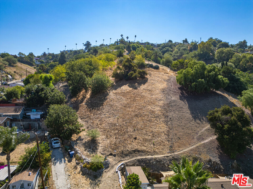 BUILD READY! Comprehensive SURVEY, SOIL, and TOPOGRAPHIC reports completed and IMMEDIATELY AVAILABLE, saving months of time and thousands in upfront costs. This EXCEPTIONAL opportunity in prime Lincoln Heights, just 3 miles from Downtown LA, is an EXPANSIVE 9,865 sq ft residential lot with a maximum buildable space of 3,745.91 sq. ft. - offers sweeping PANORAMIC VIEWS of the DTLA skyline. Gentle slope is perfect for stunning MULTI-LEVEL architecture, terraced gardens, or expansive view decks. Direct street access from Gillig Ave ensures quick connectivity to freeways, public transportation, and LA's top cultural and dining destinations. Surrounded by a VIBRANT community, this is the perfect BLANK CANVAS to design and build your dream home without the usual delays.