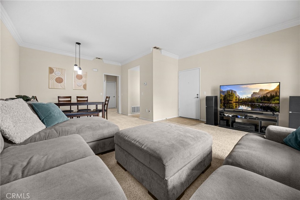 Welcome to this bright and stylish 2-bedroom, 1-bathroom condo, tucked within a secure, gated community that offers privacy, peace of mind, and resort-style amenities. Soaring ceilings, elegant crown molding, and abundant natural light create an airy, welcoming feel throughout. The updated kitchen features ample cabinet space, a pantry, built-in microwave, and dishwasher—designed for everyday ease.
One of the standout features of this home is the in-unit laundry, offering unmatched convenience and significant cost savings. Say goodbye to shared laundry rooms or laundromats—enjoy the comfort of doing laundry on your own schedule, in the privacy of your own home.
Additional highlights include central heat and air, generously sized bedrooms with ample closet space, and a spacious bathroom with a dual-sink vanity. Step out to your expansive private balcony—perfect for relaxing or dining outdoors. This rare unit also includes a space in a shared garage, storage, and an additional parking space.
Inside the gates, enjoy two sparkling pools, a spa, playground, and lush greenbelts—all within a beautifully maintained setting. With comfort, privacy, and practical amenities throughout, this move-in ready condo truly has it all.