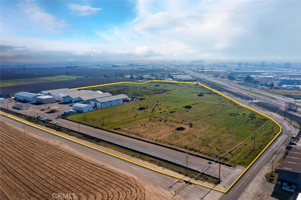 29.11 acres of prime development land in Fowler, Ca.
Located within the City of Fowler sphere of influence and adjacent to the city limits on 2 sides, the property is designated for heavy industrial use under the City of Fowler General Plan. It is in the primary development area of the city. Adjacent to the Golden State Expressway and 1/2 mile from Hwy 99 it boasts excellent connectivity on designated truck routes. Currently, the facility is a receiving and storage station for organic and conventional dried prunes, raisins, figs, and dates from throughout the state. Entire 9 acres used for processing and storage is covered with asphalt paving. There are six large fully enclosed structures on property for fumigation and storage which range from 11,200 sq. ft to 14,000 sq. ft. with asphalt floors. There is one structure of 12,600 sq. ft under roof with a concrete floor and steel beams in concrete for machinery attachment used for processing machinery. The site includes a cold storage (1,400 bin capacity) steel building, truck weigh scale, multiple inspection stations, USDA lab, business office, employee lunch room and facilities. There are 2 electrical panels (1) 480 V-1200 amps (2) 120/240V 400 amps. Ag well and domestic well on property. Two propane locations with tanks on property.
