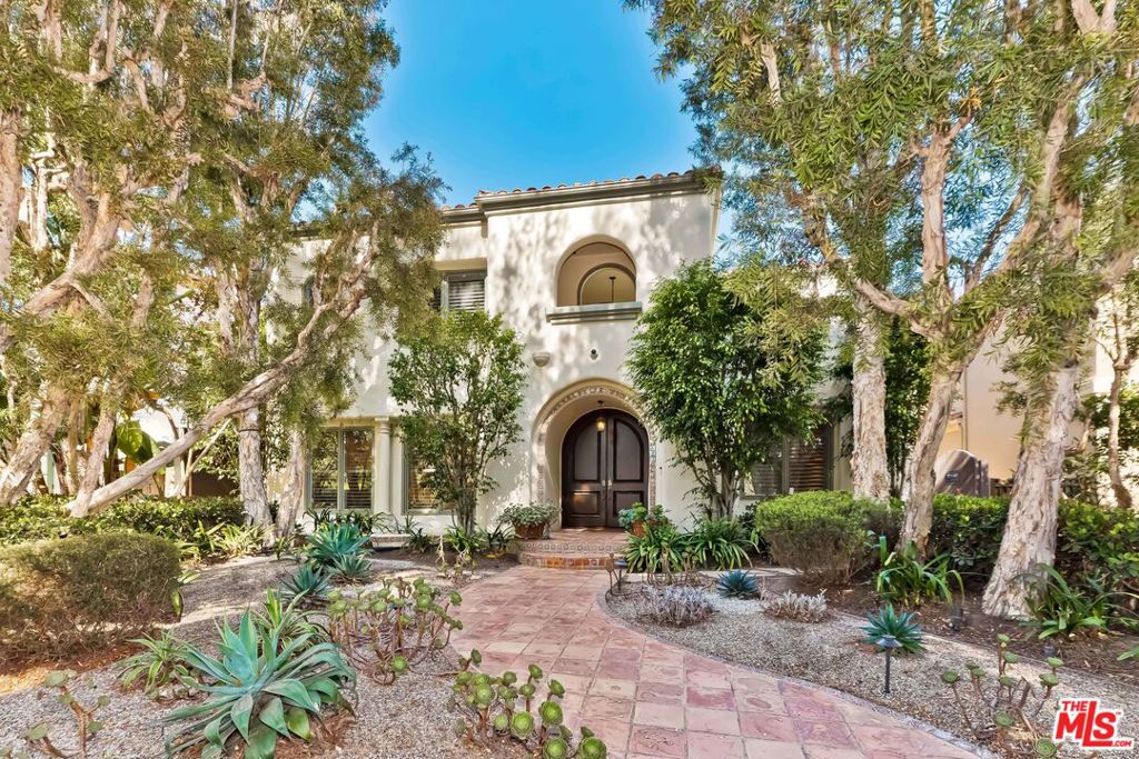 This pristine and refined Spanish contemporary home was extensively remodeled and updated in 2017 and is set on a highly desirable tree-lined street. Through a beautiful drought-resistant succulent garden, guests are ushered in via an attractive arched entrance that opens to a wide, light-filled hallway running the length of the house. High ceilings, wood beams, wood floors, skylights and intricate details throughout enhance the well-executed floor plan. Downstairs, a stunning living room, bar, generous sized dining room and private study complement the gourmet open kitchen and family room overlooking a private patio and grassy backyard with room for a pool. Upstairs, the expansive primary suite features a large sitting area, fireplace, large bath with separate tub and oversized shower, dual walk-in closets and a private balcony. Three additional bedrooms complete the second story. Downstairs offers a fifth bedroom and bath. Featuring five bedrooms and five bathrooms in over 5,000 square feet of living space, other features include a two-car garage with rooftop deck and multi-zone HVAC. Dont miss this chance to call this gorgeous residence home.