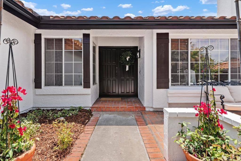 Luxurious single story home with mature native landscaping nestled in the heart of Carlsbad’s highly sought after Summit neighborhood. Freshly renovated & offering the perfect blend of modern elegance & laid-back California coastal charm. Ideal for those who crave a lifestyle of tranquility & convenience. This home has been meticulously upgraded to provide the ultimate living experience. Tucked away on a quiet cul-de-sac street, this property enjoys a peaceful neighborhood with no HOA fees or Mello-Roos taxes. Just moments from Carlsbad’s pristine beaches, shopping, dining, and top-rated schools, this home offers the best of coastal living. Upgrades include; designer exterior & interior paint, vinyl flooring, interior doors, kitchen counters, water heater, gutters, termite work, chimney refresh & more! Step inside to discover natural light flowing throughout & an interior adorned with designer finishes and high-end details throughout. The spacious living area features vaulted ceilings, stunning new flooring and custom paint throughout. The floor plan creates a seamless flow between the living, dining, and kitchen areas, while the wood-burning fireplace adds a cozy and welcoming touch as you enter. The expansive master suite is a true sanctuary, offering a generous layout with an en-suite bath, a large walk-in closet, and direct access to the serene private backyard. Whether you're enjoying a quiet morning coffee or unwinding after a long day, this peaceful retreat is the perfect place to relax and recharge. Two additional bedrooms and an upgraded hall bath provide ample space for family, guests, or a home office. The home also features a convenient interior laundry and an attached two-car garage, offering practical amenities without sacrificing style. Home is sweet on Sutter St.