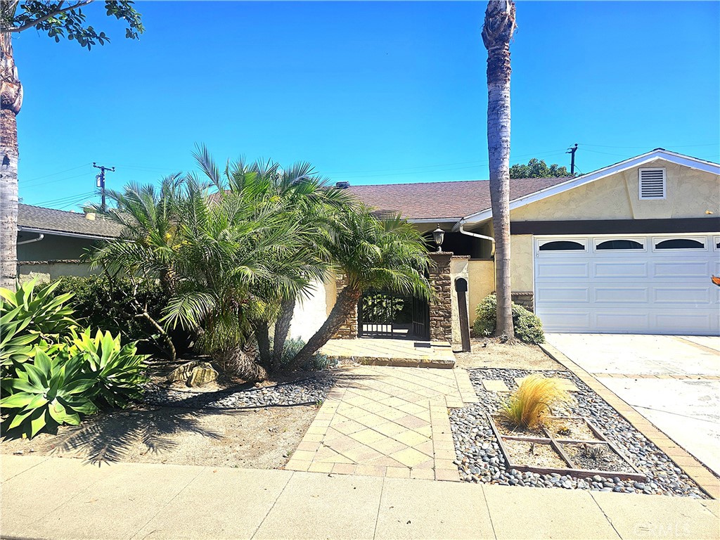 Remodeled Home in Golden West Estates – 2 Master Bedrooms!
This beautifully updated, move-in ready home offers an open floor plan with gorgeous hardwood floors throughout. The remodeled kitchen features travertine tile, quartz countertops, stainless steel appliances, and newer cabinets. The spacious family room includes a fireplace, ceiling fan, recessed lighting, and is wired for surround sound—perfect for a home theater.
Two master bedrooms provide comfort and privacy. The main master has direct access to the backyard patio and hot tub. Both master baths are remodeled with travertine showers. The third bedroom features wainscoting and built-ins. The updated hall bath includes a cast iron tub and a convenient door to the backyard.
Step outside to a large, beautifully landscaped backyard with a covered patio, hot tub/jacuzzi, fruit trees, drought-tolerant plants, and a storage shed—ideal for relaxing or entertaining.
Other highlights include dual-pane windows/sliders and a finished garage with epoxy flooring and attic storage. Prime location near parks, shopping, restaurants, Golden West College, and just minutes from the beach. Don’t miss this one!
