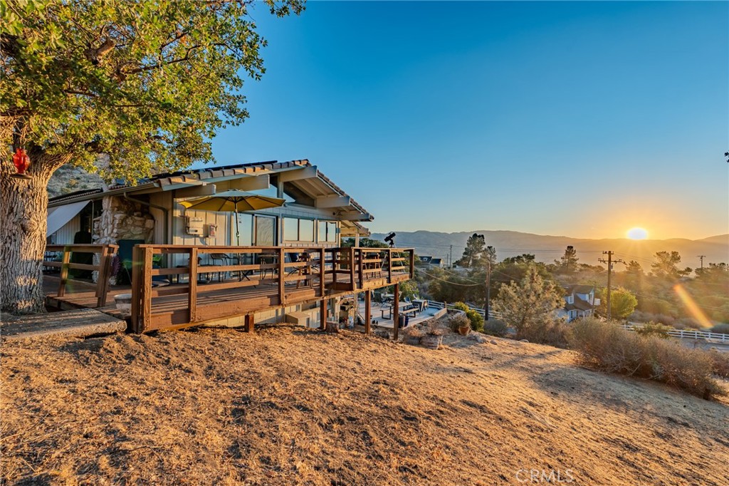 Views, Views, Views! This beautifully updated two-story home in West Golden Hills offers some of the most breathtaking scenery Tehachapi has to offer. With vaulted ceilings, expansive windows, and natural light flooding every corner, you'll enjoy panoramic vistas from sunrise to sunset.
Fully renovated just 6 years ago, the home features a modern kitchen with butcher block counters, stylish backsplash, and updated appliances, plus refreshed bathrooms, new roller shades, and consistent flooring throughout (extra flooring included!). Comfort is key with new mini-splits for heating and cooling, ceiling fans, and a fully electric setup supported by a solar system.
The downstairs welcomes you with a spacious open area perfect for entertaining or a home office anchored by a gorgeous rock fireplace. You'll also find two bedrooms, a full bath, and a laundry room. Upstairs, the light-filled living space connects seamlessly to the kitchen and primary suite, complete with an updated bath and walk-in shower.
Additional highlights include Tile roof recently redone, Rain gutters, Concrete driveway extension for extra parking, & Approx. 1,800 sq. ft. total living space (900 sq. ft. per level).
This home combines comfort, style, and jaw-dropping views all in a prime location. Seller is motivated for a quick sale, so don't wait, schedule your showing today and make this stunning property yours!