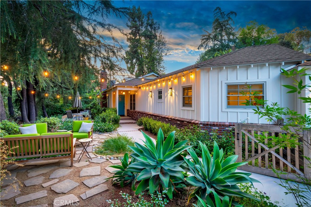 Welcome to your resort-style oasis—Home Sweet Home! This beautifully remodeled custom ranch-style residence, set on an expansive 26,000+ sq. ft. lot, total of 2846 sq. ft of living space, offers the perfect blend of luxury, comfort, and serenity in one of the area's most sought-after neighborhoods. From the moment you arrive, the professional landscaping and meticulous attention to detail invite you into a lifestyle of relaxed elegance. Inside, the heart of the home is a stunning high-end kitchen featuring top-of-the-line finishes, including a Wolf stovetop, stone countertops, beautifully crafted cabinetry, an island with seating, a charming breakfast nook, and a built-in desk area—all enhanced by timeless brick accents. This lovely home showcases warm wood flooring and dramatic vaulted beam ceilings in the great room, dining area, and primary suite, creating an atmosphere of spaciousness and style. The great room centers around a cozy fireplace, with skylights bathing the space in natural light. The luxurious primary suite offers direct access to the backyard, a spa-like bathroom, and a generous walk-in closet, while the additional bedrooms are nicely sized—one offering flexible use as a den or office. A thoughtfully designed extra-large laundry room with built-in home office space ensures functionality for modern living. Outside, the resort-style backyard is a private paradise, featuring a sparkling pool with a lighted fountain, multiple Zen-inspired sitting areas, a covered patio perfect for al fresco dining, and lush gardens including irrigated raised beds, fruit trees, and a thriving orchard. The attached two-car garage provides ample storage, and the property’s location within the coveted Wilbur Elementary, Portola Middle, and Taft High School districts offers exceptional educational opportunities. With nearby hiking trails, exquisite craftsmanship, and unmatched tranquility, this home is the ultimate indoor-outdoor sanctuary—an ideal place to unwind, entertain, and truly feel at home. You will be impressed by the quality and condition of this home. Schedule your private showing today!
