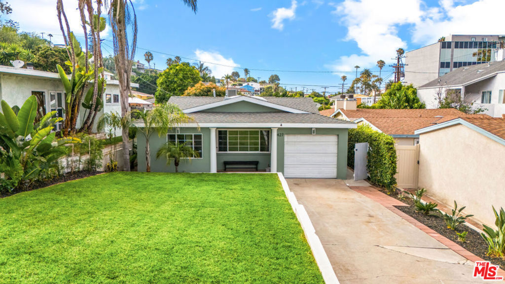 Welcome to your own slice of Playa Del Rey paradise! This darling, north-south facing home sits on the quiet, residential stretch of Manchester Ave-far from the hustle, yet just a 30-second jaunt up the hill to the sparkling Pacific Ocean. Boasting 3 spacious bedrooms plus a versatile flex room ideal for an office, playroom, or creative space, this 1,647 sq. ft. gem has been lovingly refreshed with thoughtful updates throughout. The interiors are freshly painted, the kitchen shines with refinished cabinets, sleek new countertops, a new sink, refrigerator, and updated hardware. Both bathrooms have been tastefully renovated with new tile, fixtures, and cabinetry. Refinished hardwood floors, a new skylight, vaulted ceilings, and charming original details create a bright, airy, and inviting atmosphere. Step outside to your own private retreat, a lush, hedged backyard with a bubbling Jacuzzi, a covered patio perfect for al fresco lounging, and a fruitful, mature avocado tree ready for harvest. The one-car garage includes laundry (washer & dryer), adding practicality to this peaceful beachside haven. Homes like this are a rare find in Playa! Experience everyday vacation vibes while being minutes from shops, dining, and beach trails. Available for immediate move-in!