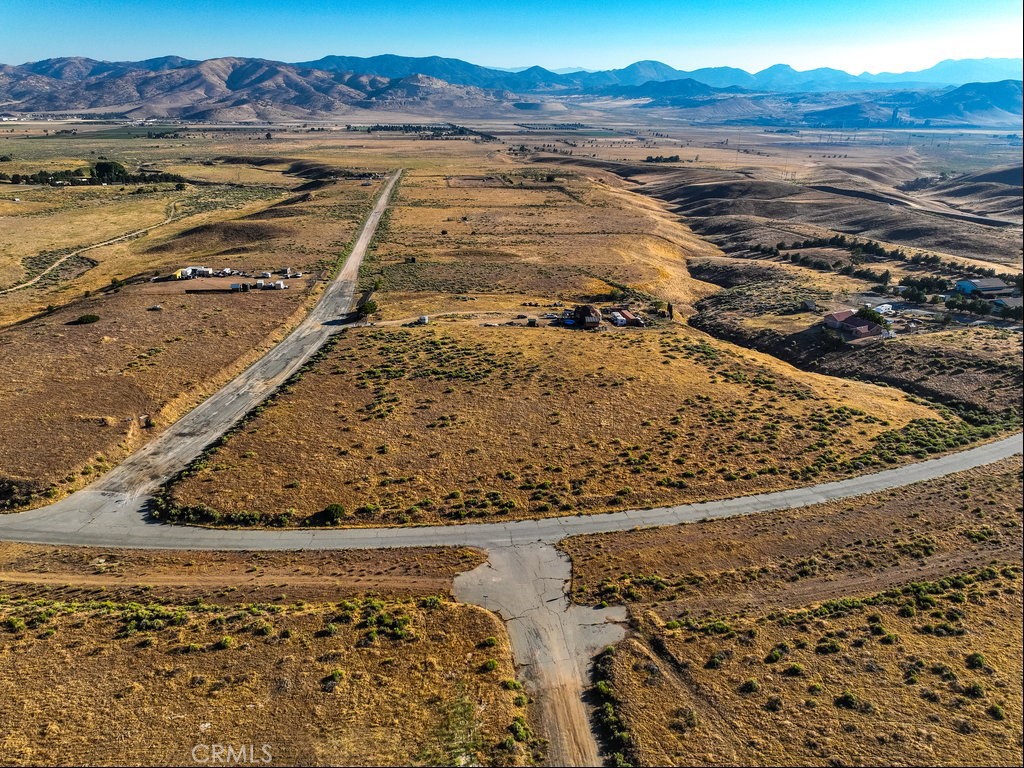 ***Appr. 300 feet from paved Dennison Rd***Fabulous lot with easy access to downtown and 58 Freeway. Everything you need is just a short drive away. This lot is in Kern County jurisdiction and zoned for E (2.5) RS (Estate 2.5 acres Residential Suburban Combining) which allows for a wide range of uses. This is really an unique opportunity to live off grid and enjoy a peaceful rural lifestyle with expansive open spaces and breathtaking mountain view. Do not miss this opportunity to make your dream come true on this blank canvas. Please note that the boundaries represented in the photos are only an estimation. Buyers should verify every aspect aligns with their vision for the property.