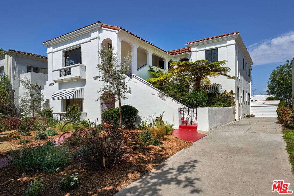 Welcome home to wonderful Wilshire Vista! This spacious 3 bedroom, 2 bath upper unit in a beautiful 1933 Spanish duplex offers gorgeous original detailing including high ceilings, working fireplace, formal dining room and eat in kitchen area, charming vintage style bath with separate showers, and hardwood floors throughout. Additionally, you will enjoy the renovated kitchen with all new stainless steel appliances, a separate laundry room with new in-unit washer and dryer, ample closet and storage space, new central AC with "Nest" thermostat, new tankless water heater, a detached two-car garage and access to a beautiful shared backyard perfect for relaxing or entertaining. Centrally located on a quiet tree-lined street, you can walk to LACMA and tons of nearby neighborhood restaurants, including Lalibela, Meals By Genet, Uovo, Hiho Cheeseburger, KazuNori, Ray's and Stark Bar, Republique, Met Her At A Bar, Genwa Korean BBQ and Apollonia's Pizzeria.