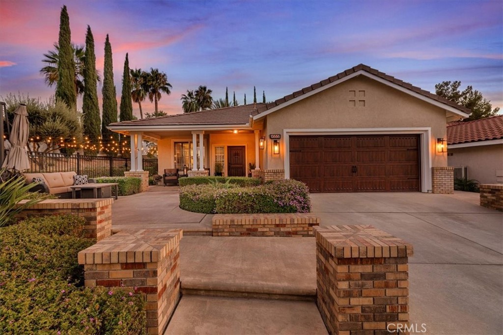 Experience the perfect blend of style, comfort, and resort-inspired living in this beautifully upgraded 3-bedroom, 2-bath home, ideally located in the desirable Horsethief Canyon Ranch community. From the moment you arrive, the solid wood entry door sets the tone for the craftsmanship and elegance found throughout. Inside, you’ll appreciate the thoughtful design, abundant natural light, and high-end finishes that make this home truly move-in ready.
The fully remodeled kitchen is a showpiece, featuring stainless steel KitchenAid appliances, a quartz center island with breakfast counter, and an open layout framed by large windows overlooking both the side and back yards. Every detail has been considered—large apron sink, pot filler, decorative tile backsplash, pot and pan drawers, pantry, and slide-out spice racks for effortless organization. High ceilings in the kitchen and living room create a bright, airy atmosphere, while the fireplace and built-in Bose speakers add warmth and ambiance.
Retreat to the luxurious primary suite, where the updated, enlarged shower creates a spa-like experience. Throughout the home, you’ll find consistent laminate wood flooring, crown molding, neutral tones, and real wood shutters with ceramic window tinting for energy efficiency. Comfort is further enhanced by a QuietCool whole-house fan, ceiling fans in every room, and a new AC unit.
Step outside to your private backyard paradise, complete with a sparkling pool featuring a waterfall, full bench seating, 22 soothing jets, and LED lighting. Gather with friends around the fire pit, enjoy the slatted wood patio for shaded dining, or host a barbecue in the hardscaped yard designed for easy entertaining. The property also features key lime, avocado, and lemon trees, a charming garden bed, and a unique side yard enclosed within a wrought iron fence—offering additional usable space.
Additional upgrades include a 19-panel Fully Paid Solar System, Electric vehicle NACS wall charger, upgraded electrical panel, recessed lighting, garage with custom cabinetry, attic storage, and included Samsung washer and dryer in the laundry room. The Community offers; 2 Community pools, Dog Park, Pickleball/Tennis Court, several parks/playgrounds, Basketball Court, Seasonal Festivals, Bingo nights, security, local elementary school, clubhouse with library and rentable space. Low HOA and taxes - This is a must see!