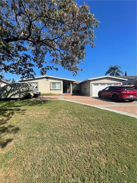 Photo of 1411 E Pioneer Drive, West Covina, CA 91791 (MLS # CV26220454)
