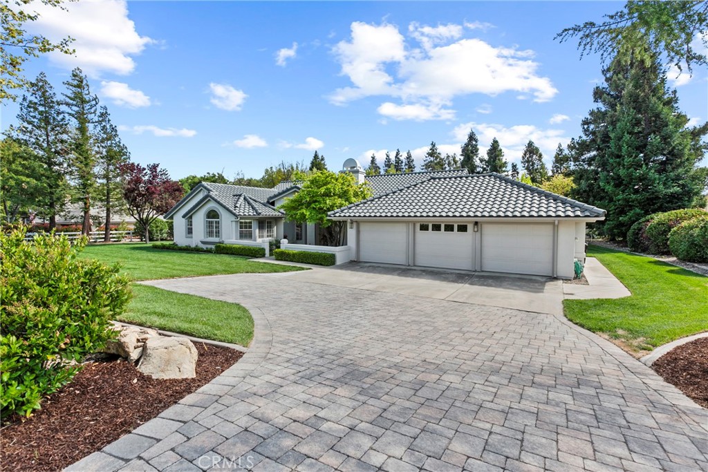 Don't miss out on this rare and lovingly remodeled estate nestled at the end of a peaceful cul-de-sac in the highly sought after Peacock Ranch area. This beautifully updated westside Templeton home offers the perfect balance of luxury, privacy, and Central Coast indoor/outdoor living. Set on a fully usable park-like one-acre lot with mature trees, this property is a true sanctuary.
Entering the property you will be greeted by a custom paver driveway, meticulous landscaping with custom lighting, & new professional paint and light fixtures.
The thoughtfully designed single-level layout features 4 bedrooms and 3 bathrooms with a split-wing design. This home has multiple living areas, vaulted ceilings, crown moldings, & an incredible kitchen. Step inside to find bright, airy living spaces with new luxury hardwood flooring and cozy up around either of the two fireplaces. New premium carpeting brings extra comfort to the bedroom spaces and in the primary suite you will find a spacious bedroom with cozy seating area, a spacious walk-in closet, & renovated bathroom with dual-vanity, soaking bathtub, & walk-in shower.
At the heart of the home, the fully remodeled kitchen impresses with custom soft-close cabinetry, stunning quartz countertops, & quality finishes, ready for gourmet cooking or casual gatherings. The kitchen also features upgraded appliances, a large breakfast bar & an inviting sitting area with large windows that let the natural sunlight in.
Outside is an oasis of lush lawn & the private well makes irrigating simple & efficient. While the mature trees & park-like setting create an unparalleled sense of peaceful seclusion, there are multiple patios & entertaining spots as well. Whether relaxing under the canopy of trees, entertaining under the stars, or dreaming up future plans like a pool, vineyard, or ADU, this property has endless potential.
The oversized, fully finished 3-car garage with custom epoxy flooring adds even more value and versatility. Additionally the home is equipped with newer HVAC and tankless water heater systems. 220V is installed in the garage ready for EV charging. If you need even more storage, a large shed in the backyard provides ample room.
Located just minutes from downtown Templeton’s charming shops, award-winning schools, restaurants, renowned wineries, & only a 25 min drive to multiple beaches, this rare offering delivers the lifestyle you've been searching for. Call your Realtor today for your tour!