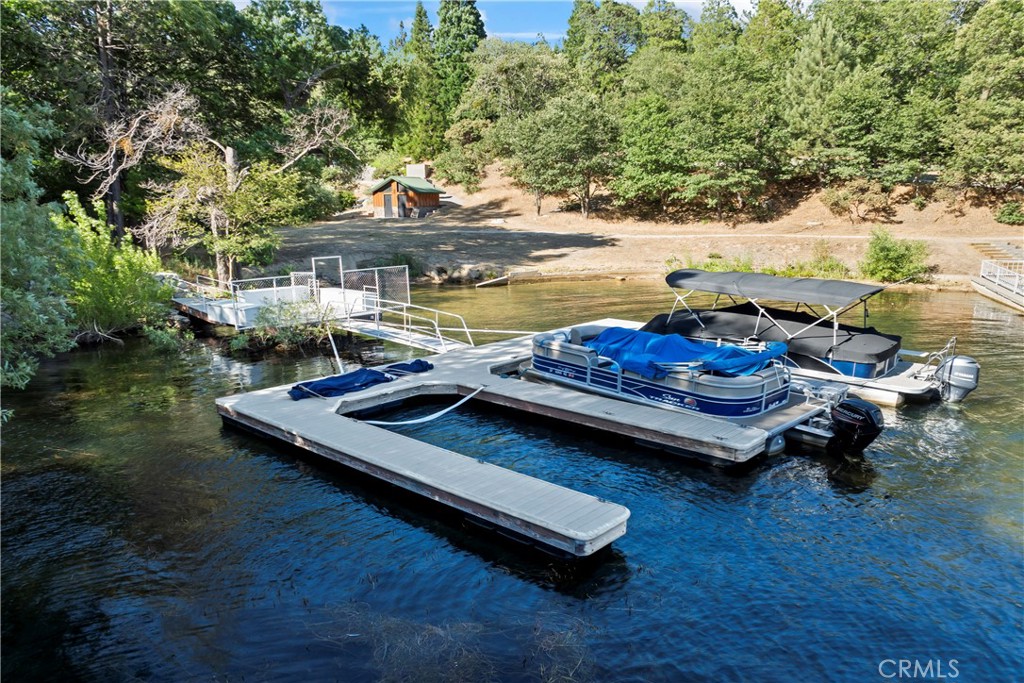 Situated in the very back of Winter Harbor - Accessed via ALA Access in Gated North Shore Estates - Available for Anyone in Arrowhead Woods to Purchase - This Premium Dock Slip is the End of a Triple - with Gorgeous Views of Always Beautiful Lake Arrowhead. Just A Stones Throw to the ALA Bathrooms. An Easy Pathway Leads you to this Lovely Location - where the Mornings are Tranquil - The Evenings are Magical and Fun in the Sun is to be Enjoyed in between! Safely Tucked Away at the very back of the Bay offering Privacy and Calm Waters. A Great Fishing Hole too! Make it Easy - Larson 254 Deck Boat is Available for Additional $$. This Sweet Dock Slip is Your Portal to Enjoy All Lake Arrowhead has to offer! Leave the Car at Home - Take your Boat to The Lake Arrowhead Village, Lake Arrowhead Resort, UCLA Lake Arrowhead Lodge and The Marina for Dining and Entertainment Experiences! Don't Tell Anyone About our Secret Spot at the Island! You'll be surprised at the World that will open to you with your Dock Slip and Boat! Party Platform with Dock Box. Gated Access to Boat Slips for extra security. Located at ALA Access 60 within Gated North Shore Estates with plenty of Parking for Dock Owners. This is a Peaceful and Picturesque Place...Don't Let this opportunity "Slip" Away! Check out the Dock Slip and Area Right Now - https://www.youtube.com/watch?v=oOCyqkMjU20