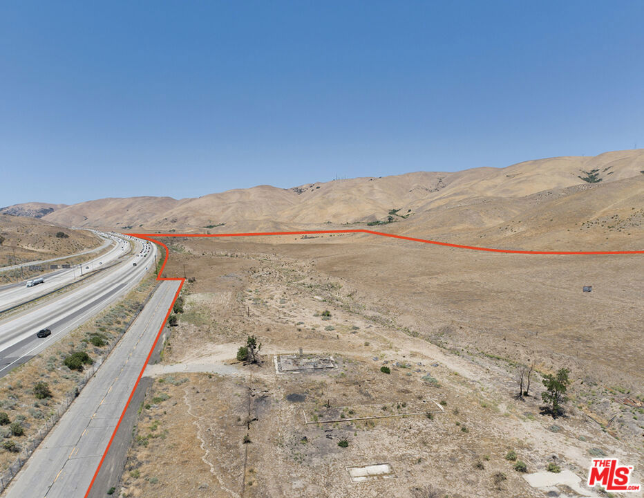 We are pleased to present a unique opportunity consisting of +/-85 acres of primarily flat commercial land along the 5 Freeway just north of the intersection of Highway 138. This site is well-positioned for a developer to take advantage of the 250,000+ vehicles per day traveling along one of the busiest freeways in the world that provides access to Los Angeles ports, Central Valley agricultural businesses, San Francisco tech hubs, and the entire West Coast. Ownership has a land use survey completed by David Evans and Associates, Inc. which can be made available for qualified buyers. Potential uses include hotels/motels, drive-through services, utility-scale solar energy, along with a myriad of other options, which the Buyer shall rely on their own due diligence and investigations to confirm in full. With nearby future developments including the fully entitled 12,000+ acre Centennial at Tejon Ranch Master Planned Community approximately 3 miles away, which include 19,000+ homes and 10M+ square feet of retail/public/business park/office space/civic development, the next owner of these parcels may be well positioned for significant growth over the coming years. Also nearby is Pyramid Lake only 5 miles to the south, and the Tejon Ranch Commerce Center just 8 miles to the north. Contact the listing team today for additional information regarding this unique opportunity.