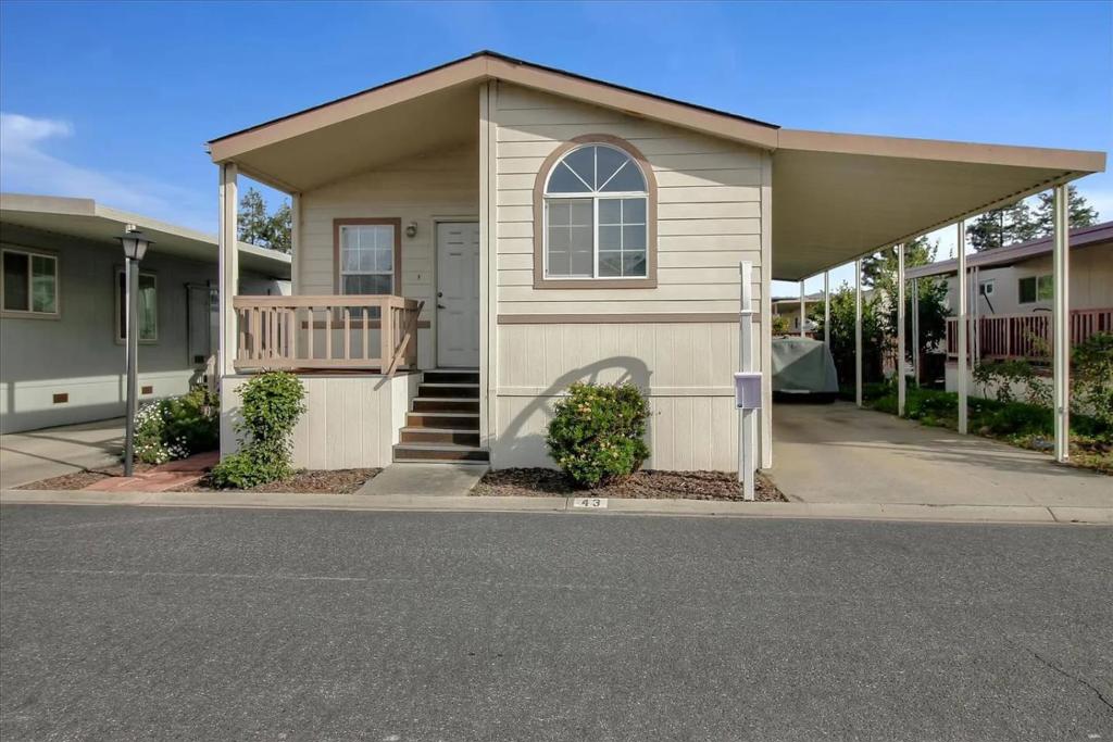 Welcome to this bright and spacious 2 bedroom, 2 bathroom home located in the highly sought-after all-age community of San Jose Verde. This well-maintained home features vaulted ceilings and a ceiling fan in the living room, providing a light, airy atmosphere year-round. Dual pane windows throughout ensure energy efficiency and quiet comfort. The open-concept kitchen is a standout, complete with tile-edged countertops, a convenient snack bar, and ample cabinet space perfect for cooking and entertaining. Adjacent to the kitchen, you'll find a dedicated indoor laundry room for added convenience. The guest bedroom and hall bathroom are generously sized with plenty of storage, ideal for family or visitors. Retreat to the spacious master suite, which includes a ceiling fan, large closet, and a private bathroom featuring a shower over tub. Enjoy the outdoors in your own small wrap-around yard, great for gardening, relaxing, or creating your own private oasis. Dont miss out on the opportunity to own this comfortable and stylish home in one of San Joses most welcoming communities!