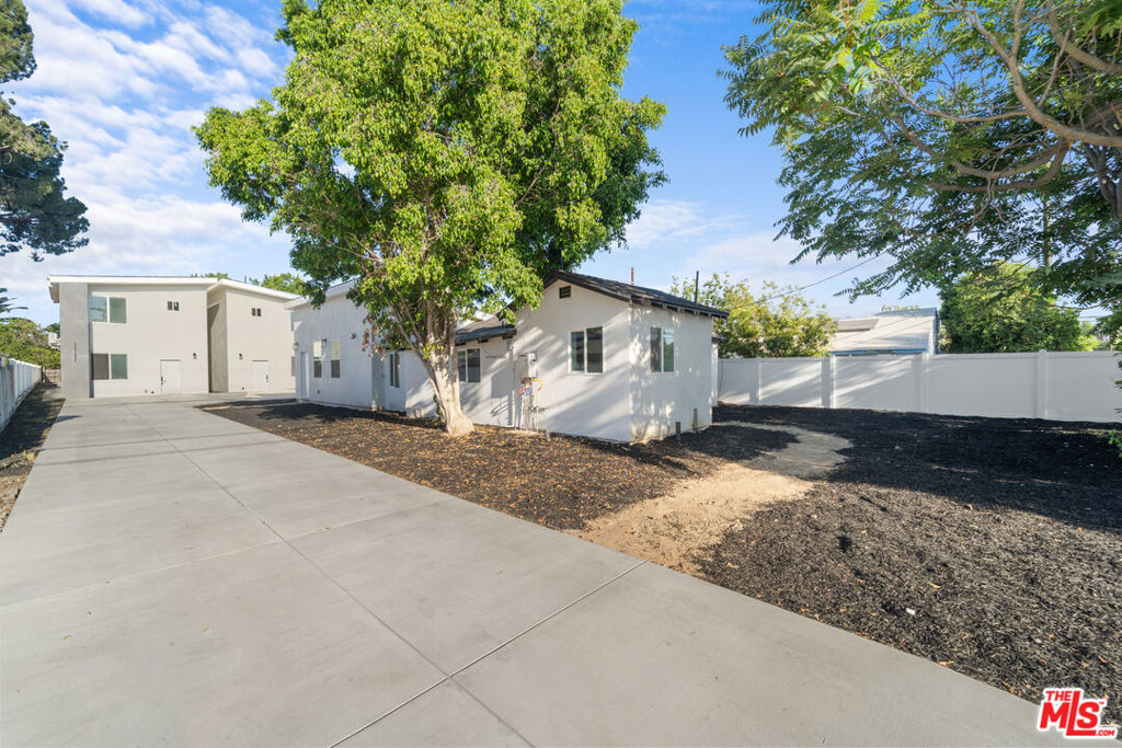A Rare, Once-in-a-Generation Offering! Exceptional opportunity to own a newly constructed, income-producing 4-unit estate in the heart of Northridge. Situated on an expansive 9,000+ sq ft lot, this thoughtfully designed property blends modern luxury, functionality, and long-term investment potential. This unique residence features three newly built units and one fully remodeled original home, totaling approx. 3,700 sq ft with 10 bedrooms and 8 bathrooms. Each unit showcases stylish finishes, open-concept layouts, and abundant natural light. The kitchens are outfitted with sleek cabinetry and quartz countertops. Soaring ~25' ceilings, designer lighting, and contemporary flooring add a sophisticated touch throughout. Property Breakdown: * Main House: 2 Bed | 2 Bath | ~900 sq ft Fully renovated with modern upgrades and a spacious private yard * Detached ADU: 4 Bed | 2 Bath | ~1,200 sq ft Brand new with dramatic ceilings, mini-split systems, and solar panels * Detached SB9 Unit: 3 Bed | 3 Bath | ~1,200 sq ft New construction with vaulted ceilings, mini-split systems, and solar panels * Attached JADU: 1 Bed | 1 Bath | ~354 sq ft Compact and private, ideal for extended family, guests, or rental income. Outdoor low-maintenance areas, and a generous driveway for off-street parking. Live in one, rent the rest, and build long-term wealth. This is more than just a property, it's a fully realized, income-generating opportunity with standout design, prime location, and exceptional value!