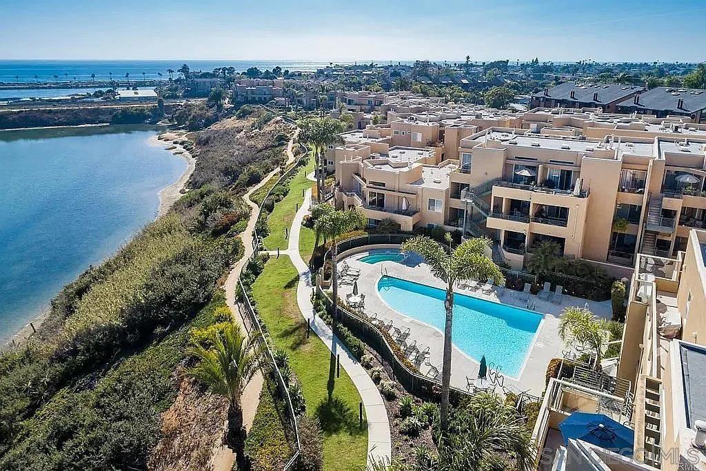 Enjoy stunning ocean and lagoon views from this spacious 2-bedroom, 2-bathroom condo located in the prestigious gated community of Ocean Pointe, just minutes from Carlsbad Village and Tamarack Beaches. This beautifully updated home features brand-new carpeting and flooring throughout, a gourmet kitchen perfect for entertaining, and an open-concept layout that maximizes natural light and views. The oversized primary suite offers a luxurious escape, complete with two separate closets, including a 9x5 walk-in, and a spa-like ensuite bath with a deep soaking tub. Two reserved parking spaces in a secure, underground garage, two private storage units, access to resort-style community amenities and prime location close to dining, shopping, beaches, and more. Don't miss this opportunity to live the coastal lifestyle you've always dreamed of!! Possible third bedroom by converting and closed dining room to an office or bedroom. Large eat in kitchen space already. Enjoy stunning ocean and lagoon views from this spacious 2-bedroom, 2-bathroom condo located in the prestigious gated community of Ocean Pointe, just minutes from Carlsbad Village and Tamarack Beaches. This beautifully updated home features brand-new carpeting and flooring throughout, a gourmet kitchen perfect for entertaining, and an open-concept layout that maximizes natural light and views. The oversized primary suite offers a luxurious escape, complete with two separate closets, including a 9x5 walk-in, and a spa-like ensuite bath with a deep soaking tub. Two reserved parking spaces in a secure, underground garage, two private storage units, access to resort-style community amenities and prime location close to dining, shopping, beaches, and more. Don't miss this opportunity to live the coastal lifestyle you've always dreamed of!! Possible third bedroom by converting and closed dining room to an office or bedroom. Large eat in kitchen space already.