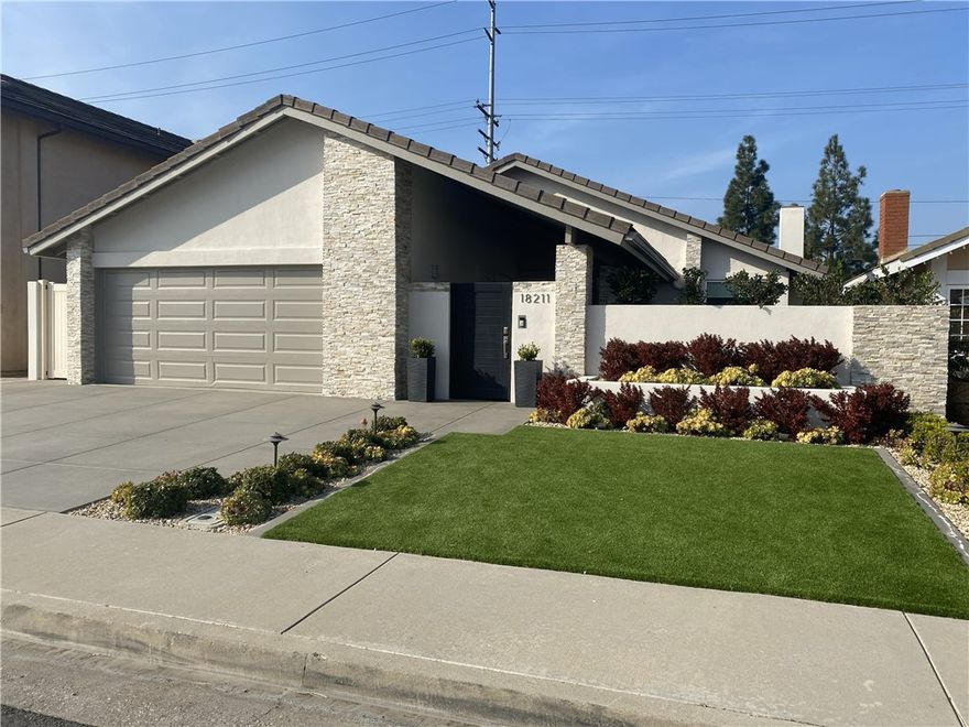 Lovely single story home in great Fountain Valley neighborhood. Three bedrooms. two baths with 2 car-attached garage. Outdoor backyard with firepit and BBQ grill that is great for entertaining. New neutral paint inside. Upgraded luxury vinyl flooring throughout the house. Upgraded lighting all-through-out. Newer double paned windows. High-end kitchen cabinets, fixtures, quartz kitchen countertops & backsplash. Stainless steel appliances (Kitchen Aide). Master Bedroom with upgraded en-suite bathroom.  All bedrooms have built in cabinetry. Third bedroom has a separate entrance that goes directly from the garage/outside.  Wine cooler in the outdoor entertainment kitchen.  Low maintenance front and backyard with high end-artificial turf. EV charging outlet in the garage. Refrigerator included with the lease.  Washer & Dryer included upon request. Gardener included with the monthly rent.  This property is a "Must-see".