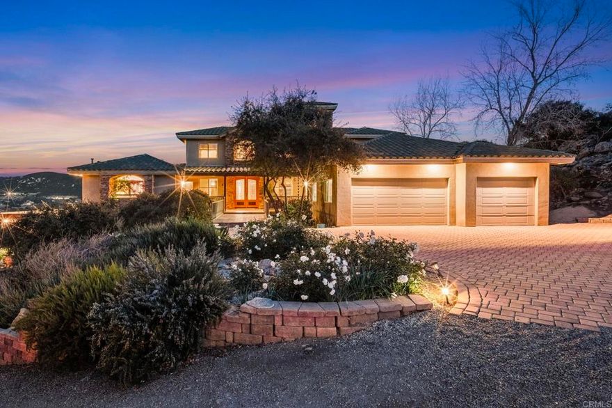 The seller will entertain offers between $1,699,000 and $1,949,000. Discover unparalleled serenity and stunning views on this nearly 9-acre equestrian estate, perfectly situated adjacent to county land and the sprawling 650-acre Simon County Preserve. This estate is enhanced by a fully owned 45-panel solar system, producing vineyards with Merlot, Zinfandel, Sangiovese, Cabernet Sauvignon, and Cabernet Franc grapes, along with 20 olive trees and a variety of fruit trees including peach, apricot, apple, and lemon.With direct access to miles of scenic trails for horseback riding and hiking, this property offers a unique lifestyle that seamlessly blends outdoor adventure with refined living.  This custom-designed home is a true entertainer's dream. It boasts a gourmet kitchen with an expansive granite island, a professional-grade 6-burner Dacor range, a warming drawer, and a double-drawer dishwasher—all complemented by breathtaking views. The home’s sweeping patios, indoor/outdoor bar, and multiple entertaining spaces create the ideal setting for gatherings or peaceful relaxation.  While offering the tranquility of rural living, this property is conveniently located just five minutes from downtown Ramona, 25 minutes from Poway, and approximately 45 minutes from San Diego’s world-class beaches. Surround yourself with the charm of a vibrant community known for boutique wineries, local restaurants, unique shops, vineyards, and orchards. A short drive away, you’ll find Julian, famed for its delightful apple pies.  Embrace a lifestyle of luxury, sustainability, and natural beauty. Your personal paradise awaits!