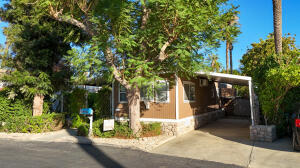 Cute Home with plenty of space inside. Construction upgrades make home feel newer. Beautifully landscaped, private yard.Large shade tree helps keep the home cooler. Gated Community. 55+ park.