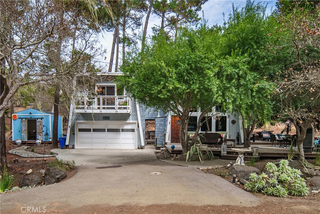 Tucked away among the majestic pine trees of Cambria, this updated 2-bedroom home with a sleeping loft offers a serene escape that feels worlds away from the everyday. Set on over a quarter acre, the property combines privacy, charm, and modern updates, making it an ideal retreat for full-time living, part-time enjoyment, or as a licensed vacation rental.
Inside, the home has been thoughtfully updated over recent years with new flooring throughout, fresh interior and exterior paint, and remodeled kitchen and bathroom spaces. The layout features two comfortable living areas, enhanced by a newer electric fireplace—the perfect cozy touch for relaxing evenings. Dramatic floor-to-ceiling windows in the main living room fill the space with natural light and frame the surrounding pine trees, bringing the outdoors in. A dedicated wine room adds a touch of sophistication and is ready for entertaining or personal enjoyment.
The primary bedroom offers a private balcony overlooking the tranquil property, while the expansive outdoor deck is designed for gatherings with friends and family. Complete with a built-in gas fire pit, the deck is ideal for year-round entertaining, stargazing, or simply enjoying the peace and quiet of this secluded setting. Adding to the home’s versatility is a newly constructed studio workshop with electricity, perfect for hobbies, creative projects, or a private workspace.
Beyond its beautiful interiors and functional spaces, the home’s location is a true highlight. Surrounded by mature pines and natural beauty, it feels tucked away and quiet, yet it remains convenient to the charm and amenities of Cambria.
A major bonus for both homeowners and investors is that this property is a licensed vacation rental, offering the potential for income in addition to a personal getaway. With its thoughtful updates, versatile spaces, and unbeatable setting, this home captures the best of Cambria living—a peaceful forest retreat where comfort, style, and opportunity meet.