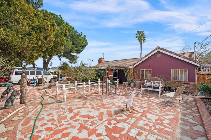 Welcome to your potential new home in the vibrant city of Bloomington! Nestled conveniently by the 10 freeway, this property offers a rare opportunity to own a spacious piece of land spanning almost 2 acres. As you step onto the grounds, you'll immediately notice the potential this property holds. The main residence boasts 4 bedrooms and 2 baths, providing ample space for comfortable living. Featuring a great-sized kitchen and living room, perfect to host family gatherings. Additionally, a detached 2-car garage offers convenience and storage options or even a great opportunity to turn it into an additional dueling unit. While this home requires some tender loving care, it presents an exciting canvas for customization and personalization to fit your unique vision. Whether you're a first-time homeowner looking to make your mark or an investor seeking an opportunity, this property invites you to unlock its full potential and create an oasis you've been dreaming of. Don't miss out on the chance to call this place your home sweet home!