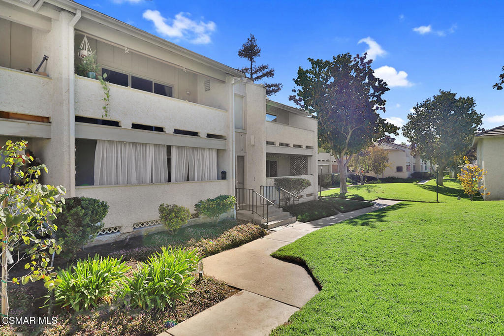 Welcome to this beautifully updated upper-level end unit filled with natural light and charm. From the moment you step inside, you'll be greeted by vaulted ceilings, laminate flooring throughout, and an inviting open floor plan that seamlessly connects the living, dining, and kitchen spaces. The recently remodeled kitchen features stainless steel appliances and modern finishes. The primary retreat offers a spacious en-suite layout with privacy and comfort, while the second bedroom is perfect for guests, an office, or a roommate setup. Step outside to your private balcony with custom built catio (enclosed patio), which overlooks the community pool and manicured green spaces, perfect for your furry friends or peaceful outdoor lounging. Additional highlights include in-unit washer and dryer, a detached one-car garage plus an additional assigned parking space, and a community that offers a pool, spa, and ample green space for outdoor enjoyment. Located near parks, biking trails, and shopping, this home offers easy access to everything you need. Whether you're a first-time buyer, downsizing, or looking for an excellent investment opportunity, this condo is a must-see! Some photos have been digitally staged.