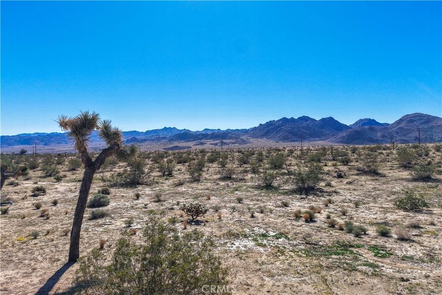 Spacious 18,000 square foot lot located in the desirable Old Town West area of Joshua Tree. This buildable parcel offers an ideal setting for a custom home, vacation retreat, or investment property. Enjoy panoramic desert and mountain views in a peaceful residential setting just minutes from downtown Joshua Tree. Utilities are believed to be available at the street—buyer to verify.
Perfectly positioned near the vibrant heart of Joshua Tree, you’ll be close to local cafés, art galleries, live music, and community events such as the Joshua Tree Music Festival and the weekly Farmers Market. With Joshua Tree National Park just a short drive away, this property combines convenience with the best of the Hi-Desert lifestyle.