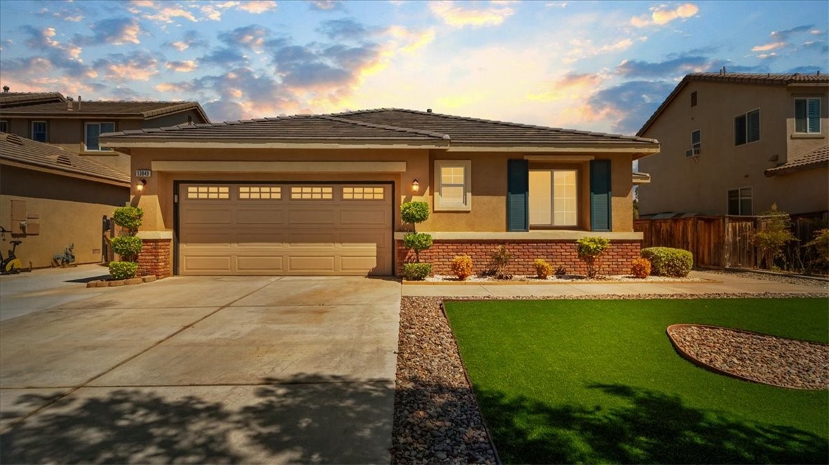 Welcome to 13849 Jackson Street, a beautifully maintained single-story home nestled in the quiet, commuter-friendly community of Oak Hills. Built in 2005, this 4-bedroom, 2-bathroom residence offers over 2,000 square feet of open-concept living space on a generous 7,198 sq ft lot. As you enter, you're greeted by a spacious living room with vaulted ceilings and a cozy fireplace—perfect for family gatherings or relaxing evenings. The open kitchen features ample cabinet space, tile countertops, and a dedicated dining area ideal for entertaining. All four bedrooms are well-proportioned, with the primary suite offering an ensuite bathroom and walk-in closet. Indoor laundry, central air and heat, and a two-car attached garage provide modern convenience, while the fully fenced backyard offers privacy and room to garden, play, or unwind. This home is also equipped with a solar power system to help keep energy costs down. Ideally located just minutes from the 15 freeway, shopping centers, and dining options, this property combines suburban comfort with easy access to city amenities. Whether you're a growing family or simply looking for single-story living in a peaceful neighborhood, 13849 Jackson St delivers space, functionality, and value in one attractive package.