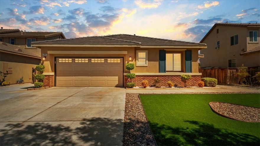 Welcome to 13849 Jackson Street, a beautifully maintained single-story home nestled in the quiet, commuter-friendly community of Oak Hills. Built in 2005, this 4-bedroom, 2-bathroom residence offers over 2,000 square feet of open-concept living space on a generous 7,198 sq ft lot. As you enter, you're greeted by a spacious living room with vaulted ceilings and a cozy fireplace—perfect for family gatherings or relaxing evenings. The open kitchen features ample cabinet space, tile countertops, and a dedicated dining area ideal for entertaining. All four bedrooms are well-proportioned, with the primary suite offering an ensuite bathroom and walk-in closet. Indoor laundry, central air and heat, and a two-car attached garage provide modern convenience, while the fully fenced backyard offers privacy and room to garden, play, or unwind. This home is also equipped with a solar power system to help keep energy costs down. Ideally located just minutes from the 15 freeway, shopping centers, and dining options, this property combines suburban comfort with easy access to city amenities. Whether you're a growing family or simply looking for single-story living in a peaceful neighborhood, 13849 Jackson St delivers space, functionality, and value in one attractive package.