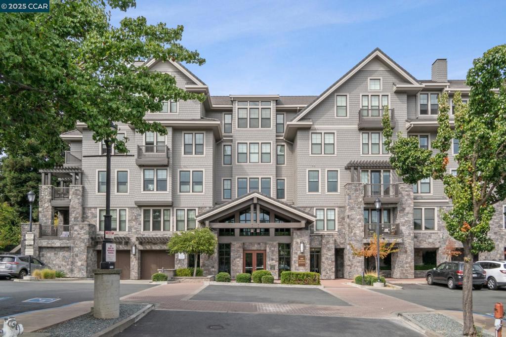Welcome to 1000 Dewing Avenue #407, a stylish 3-bedroom, 2-bathroom condo in the heart of downtown Lafayette. Ideal for those who want both comfort and convenience, this home offers a modern lifestyle surrounded by the very best of urban living. Inside, the open-concept living and dining areas are filled with natural light, creating a warm and inviting atmosphere. The modern kitchen with bar seating makes entertaining easy, while three spacious bedrooms and two full bathrooms provide comfort and functionality for everyday living. The balcony adds the ideal spot to enjoy morning coffee or evening sunsets. The secure building features an inviting lobby, elevator access, outdoor common area, and two reserved parking spaces, offering a low-maintenance lifestyle that allows you more time to enjoy the neighborhood. Just outside your door and enjoy everything downtown has to offer—coffee shops, upscale restaurants, boutique shops, trails, and community events are all just moments away. Commuters will appreciate convenient access to BART and the freeway, while others benefit from Lafayette’s top-rated schools and nearby parks. Whether you’re downsizing, purchasing your first home, or looking for a pied-à-terre in the East Bay, this condo combines downtown convenience & modern comfort.