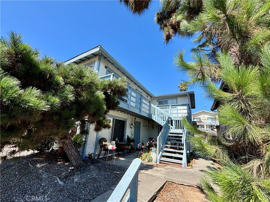 Live the coastal lifestyle in this cozy updated upstairs unit of a duplex in south San Clemente, where you can bike to surf Trestles, a world famous surf break, and park your bike in the garage. Downtown San Clemente on Avenida Del Mar is also a close bike ride away with a diverse array of shops, restaurants, bars and cafes. You can also find hiking and mountain biking trails right on the other side of the nearby San Clemente Municipal golf course and San Luis Rey Park with a playground and tennis courts just a 5 minute away. This upstairs unit has 2 spacious carpeted bedrooms with one ensuite half bath to the primary bedroom and a full bathroom in the hallway. The rest of the unit has new luxury vinyl flooring. The kitchen is fully equipped with dishwasher, gas range, and breakfast bar that connects to the spacious living room with bright windows to let the natural light in. The deck has been recently resurfaced and is a great place to watch the sunset with a peek-a-boo ocean view. The primary bedroom and living room both have double sliding glass doors to the deck for extra lighting. There are 3 parking spaces on-site, one in the garage and 2 in the shared driveway. Downstairs laundry room is also shared with downstairs tenants and machines are not owned or maintained by homeowner. Tenant is responsible for paying electricity, gas and internet, while the owner will cover water, trash, sewage, and landscaping. Smoking is prohibited on the entire property. No pets please. Don't miss this opportunity to live in one of the most desirable communities in southern California! Initial lease is for 1 year. Security Deposit is equivalent to one month's rent. Available to rent August 1, 2025.
