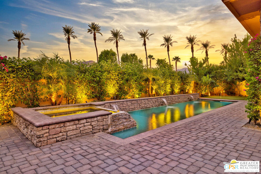 Welcome to your ultra-chic desert dream home a showstopper with a super sexy remodel that will leave you breathless from the moment you walk in. Perfectly positioned in the prestigious gated community of Palmilla, this stunningly reimagined residence blends bold design, luxurious upgrades, and jaw-dropping mountain views. Inside, you'll find a sun-drenched open floor plan with sleek porcelain tile flooring, soaring ceilings, and walls of glass that flood the space with natural light. The completely redesigned kitchen is a modern masterpiece think waterfall-edge quartz countertops, a massive island for entertaining, and top-of-the-line appliances that make every meal feel gourmet. The primary suite is pure luxury, offering postcard-worthy views of the Santa Rosa Mountains, a spa-inspired ensuite with custom vanities, a glass-enclosed shower, and high-end finishes throughout. Every inch of this home has been meticulously redone, including the cabinetry, doors, showers, toilets, vanities, pool equipment, HVAC, tankless water heater, and even the designer Emtek hardware this is not your average remodel. Step outside to your private backyard resort with a sparkling pool and elevated spa all framed by panoramic southern mountain views. Whether you're hosting cocktails at sunset or enjoying a peaceful morning swim, this is the kind of outdoor space that makes desert living unforgettable. Located just behind the Citrus Club with direct gated access for Palmilla residents, you're tucked inside a community celebrated for its lakes, bold architecture, and serene ambiance. Palmilla isn't just award-winning it's iconic.