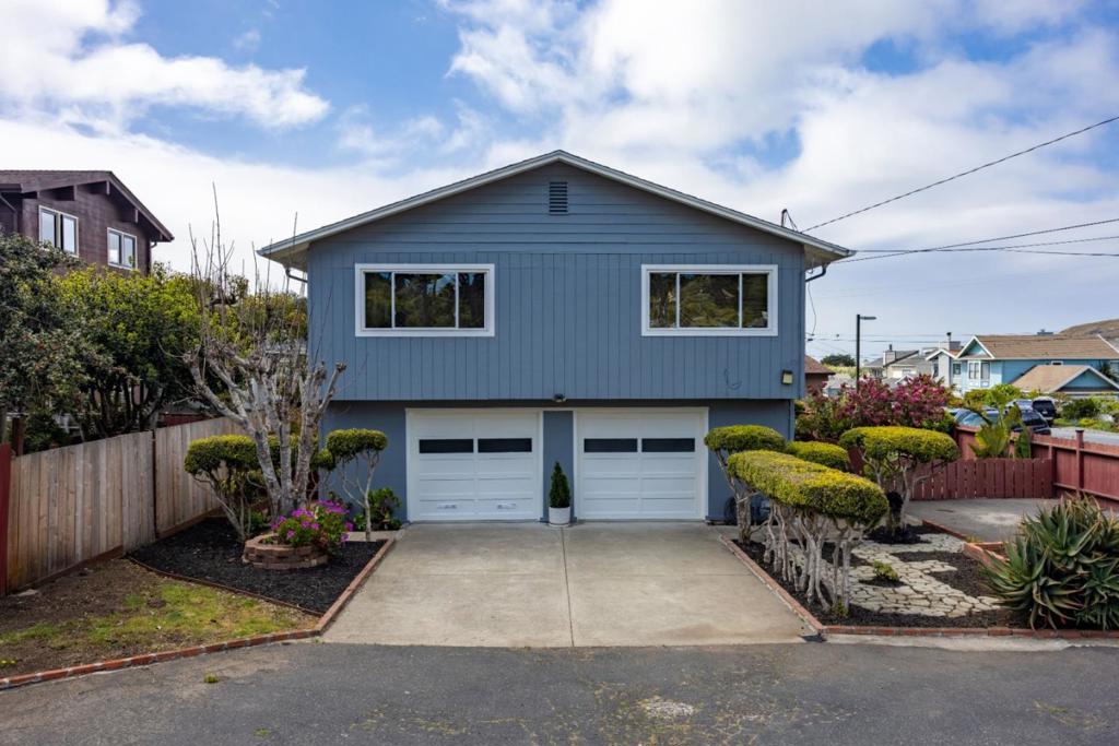 Welcome to a truly special home in a rarely available and highly sought-after neighborhood just a short walk from Rockaway Beach, biking and hiking trails, parks, charming restaurants, and local shops. This beautifully maintained property sits on a spacious, flat, gated corner lot with over 8,000 square feet of fenced outdoor space of endless potential to expand, garden, boat/RV parking or even add another dwelling or ADU to suit your needs or just enjoy the coastal breeze in your own private oasis or the partial ocean views from the upper level. Upstairs features a light-filled 3-bedroom, 2-bath layout with new interior and exterior paint, new kitchen appliances. Downstairs, a cozy and versatile 1-bedroom in law unit (approx. 561 sq ft) provides the ideal setup for guests, extended family, or rental income. With its unbeatable location, generous lot size, and welcoming character, this is a rare opportunity to own a home that TRULY HAS IT ALL! Homes like this are a rare find in a sought-after neighborhood where homes are tightly held and opportunities are few. Easy Access to Hwy 1, San Francisco, Silicon Valley, SFO. Don't miss your chance to own a piece of paradise! Schedule your viewing today or come by one of our open houses Sun 7/27/25 1:30-4:00.