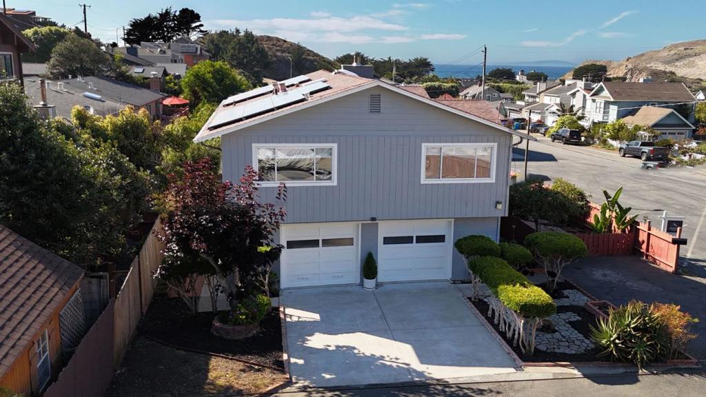 PRICE DROP ALERT! if you've been watching this home, now is the perfect time to take a second look. Don't miss your chance. Welcome to a truly special home with good bones in a rarely available and highly sought-after neighborhood just a short walk from Rockaway Beach, biking and hiking trails, parks, charming restaurants, and local shops. This beautifully maintained property sits on a spacious, flat, gated corner lot with over 8,000 square feet of fenced outdoor space of endless potential to expand, garden, boat/RV parking or even add another dwelling or ADU to suit your needs or just enjoy the coastal breeze in your own private oasis or the partial ocean views from the upper level. Upstairs features a light-filled 3-bedroom, 2-bath layout with new interior and exterior paint, new kitchen appliances. Downstairs, a cozy and versatile 1-bedroom in law unit (approx. 561 sq ft) provides the ideal setup for guests, extended family, or rental income. Homes like this are a rare find in a sought-after neighborhood where homes are tightly held and opportunities are few. Easy Access to Hwy 1, San Francisco, Silicon Valley, SFO. Don't miss your chance to own a piece of paradise! Schedule your viewing today or come by one of our open houses.