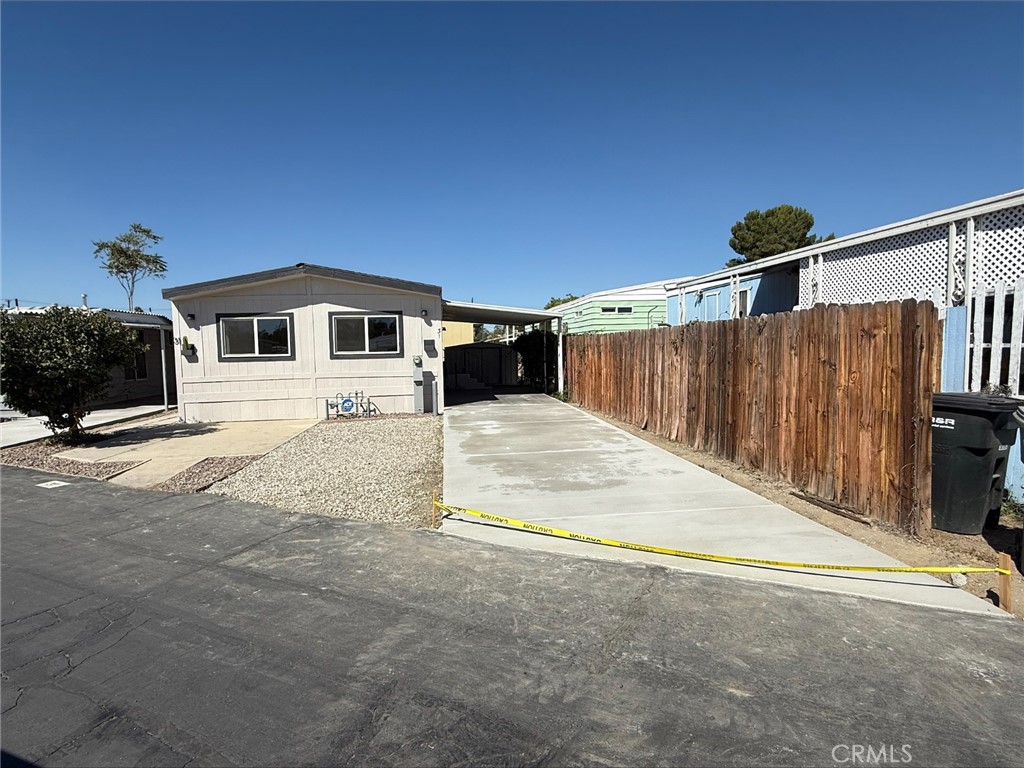 This home is 100% remodeled. New floors, windows, doors, stove, microwave, paint, lighting, bathroom. It was all done with a professional touch. The kitchen has floating shelves with lights. The bathroom looks like a model home. Both bedrooms are good size, the master bedroom has French doors leading to the carport and the laundry room(in the shed) The new windows will have new curtain and the AC blows very very cold.
Outside you have a brand-new staircase, new gravel in the driveway. Enough room for 3 cars. Brand new cement driveway.