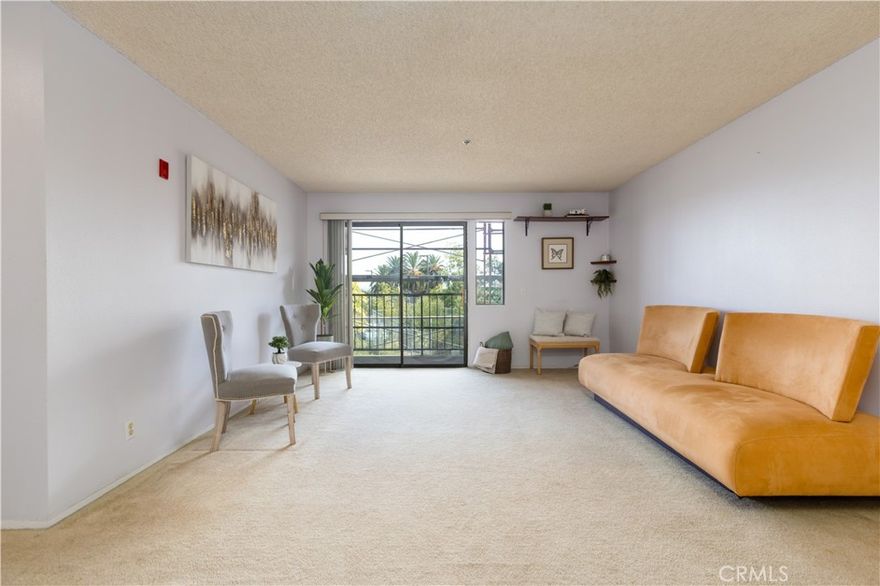 Welcome to this bright 2-suite, 2-bath condo offering 1,134 sq ft of comfortable living space. The thoughtful split-bedroom layout features two primary-style suites on opposite sides, providing privacy and flexibility for roommates, guests, or a home office setup. Enjoy large rooms, an open-concept design, and a private balcony with neighborhood and city-light views. Located in the well-maintained Sunrise Point community near SDSU, naval bases, shopping, dining, and major freeways (8, 94, 15 & 805). The secure building offers elevator access, in-unit laundry, and assigned gated-garage parking spaces plus guest parking. The exterior is currently being refreshed with a modern new look, enhancing curb appeal and adding long-term value. With just a touch of TLC inside, this condo is a fantastic opportunity for first-time buyers, students, or investors seeking a centrally located San Diego property.. Walking distance to shops, dining and more.