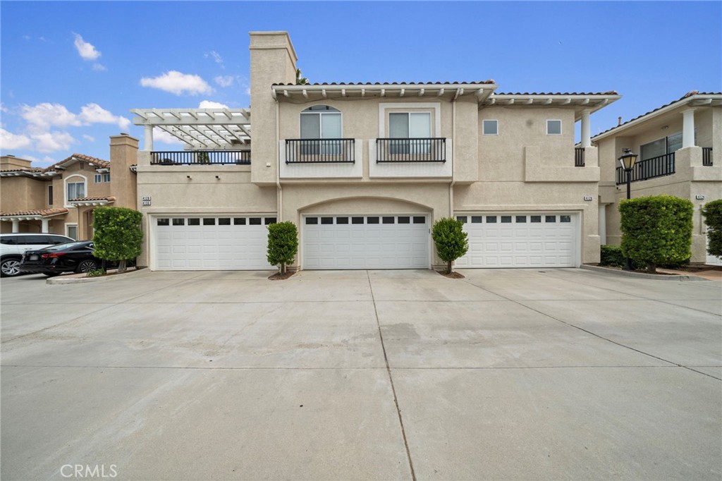 Located in Traditions at Mountain Meadows, this end-unit townhome exudes a refined charm across its two-story layout. Boasting 2 bedrooms, 2.5 baths, a loft, and a downstairs office, all spread over 1,502 square feet of interior living space and complemented by a direct-access, two-car garage.
Upon entry through the gated courtyard, you are greeted by the formal living area, a fireplace, an adjacent office and a powder bath that caters to guests. The kitchen is appointed with tile countertops, stainless steel appliances, ample cabinetry and breakfast bar. The dining room slider leads to the rear, and a wrap-around patio.
Upstairs, the spacious primary bedroom is complete with a walk-in closet, a supplementary closet, and a tub/shower combination accented by dual sinks. Additionally, a loft, graces the upper level alongside an additional bedroom and full bath.
The Traditions neighborhood offers a plenty of amenities, including a centrally located, resort-like pool and spa, a community meeting room, and park. With close proximity to shopping venues, greenbelts, picturesque walking/hiking trails, and an array of dining options.