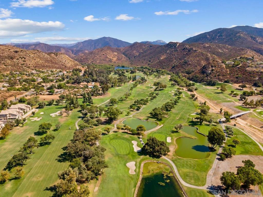 Rare opportunity to own this beautiful 2 bedroom 2 bath condo in gated prestigious Fairway Villas with amazing pool, spa & golf course views situated alongside Singing Hills Golf Course. This home offers an open-concept floorplan w/central A/C, fireplace in the living room, separate dining area, master suite with walk in closet, separate laundry room, 2 assigned parking spaces, private storage unit for extra space and a spacious outdoor patio with sweeping views.