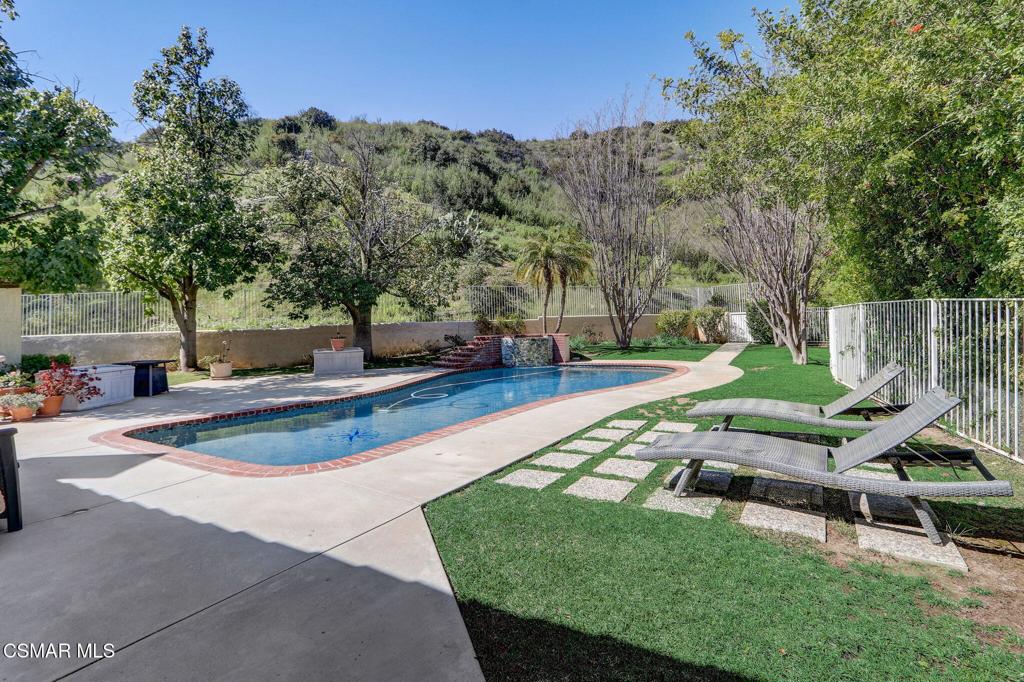 Stunning Meets Luxury with Amazing Mountain Views, Privacy and an Elevator! Located in the Prestigious Guard Gated community of Bell Canyon; this incredible community hosts a clubhouse with multiple tennis courts, a yoga and fitness studio, meeting rooms, incredible horse trails and so much more! This Exquisite Mediterranean Estate boasts an elevator for convenience from the entry level to the main level and reverse, vaulted ceilings, newer windows bringing in lots of natural light, open floor plan, cherrywood stairs, cherrywood floors, newer dual zone AC system and ducting throughout, and inside laundry room with cabinets! 3-car garage, with hidden exercise room, storage room and bathroom! The gourmet kitchen is a chef's dream, featuring stainless steel appliances, including a grade 6 burner stove, large island, custom cabinets, dual ovens and open to the family room! The Primary suite boasts a fireplace and access to the backyard with views of the sparkling pool and lush landscape. Enter the en-suite highlighting a frameless glass standalone shower, two-person jacuzzi tub and dual closets. The main floor also features an additional bedroom with a full bathroom, a private Juliet balcony and oversized windows overlooking the private backyard. Upstairs features a loft and two additional bedrooms, one with a private balcony and its own bathroom. Enjoy the outdoors in your private backyard with a newer pebble tech pool/spa with newer pool equipment, natural grass, mature trees/fruit trees, landscaping, and smart irrigation system. Entertainers Dream! Gorgeous Mountain Views! Serene & Private! Spectacular!