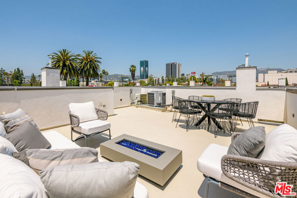 This stunning brand new tri-level Spanish home with a private rooftop deck has one of the best city views in the heart of Hollywood. Gated, structurally-independent and designed with incredible attention to detail and quality materials. Spacious open floor plan flows seamlessly with stunning wood floors, large windows for abundant natural light and multiple patio spaces. Custom Gourmet Kitchen equipped with high end Bertazzoni appliances, large eat-in island, pantry and outdoor patio. Upstairs boasts two large en-suite bedrooms including the master en-suite w/ dual sinks, freshly tiled bath and large walk-in closet. Huge private rooftop deck with 360 degree dazzling city views. 2 car garage with direct entry. Steps from Sugar Fish, NeueHouse and Columbia Square. INQUIRE ABOUT A $20K GRANT FOR THE HOME