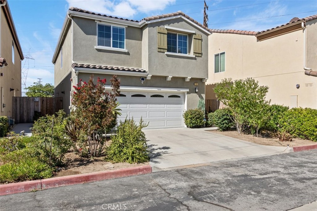 This stunning home is located in the heart of vibrant North Hollywood in proximity to major freeways, NoHo, Studio City, Burbank Studios, and the Westside in a GATED COMMUNITY with only 12 homes. It's one of only two built within the community with a FULL TWO-CAR DRIVEWAY, which is a huge bonus, and has one of the largest backyards. Enter into a massive OPEN FLOOR PLAN with large windows that let in tons of light. Your KITCHEN is a smooth transition open to the dining area with views to the backyard and living room, and is updated with NEWER STAINLESS STEEL APPLIANCES. UPSTAIRS is just as spacious with THREE LARGE BEDROOMS, a PRIMARY ON-SUITE with a WALI-IN CLOSET, DUAL VANITY, NEWER SHOWER DOOR, and BUILT-IN STORAGE. The laundry room is also equipped with EXTRA CUSTOM BUILT-IN STORAGE, HANGING RACK, and a small FOLDOUT TABLE. The backyard has been completely revamped with gravel, a PERGOLA, string lights, a FOUNTAIN, and is enhanced with Wi-Fi-controlled lights perfect for outdoor dining. OTHER UPDATES and features include some SMART HOME DIMMERS, SWITCHES, RING (TM) ALARM ENHANCED FUNCTION, and SECURITY SYS, TANKLESS WATERHEATER, and last but not least, MATURE FRUIT TREES include lemon, mandarin, avocado, and pomegranate. The perfect place to call home. (Assessor shows 1781 SF, Appraisal shows 1795)
