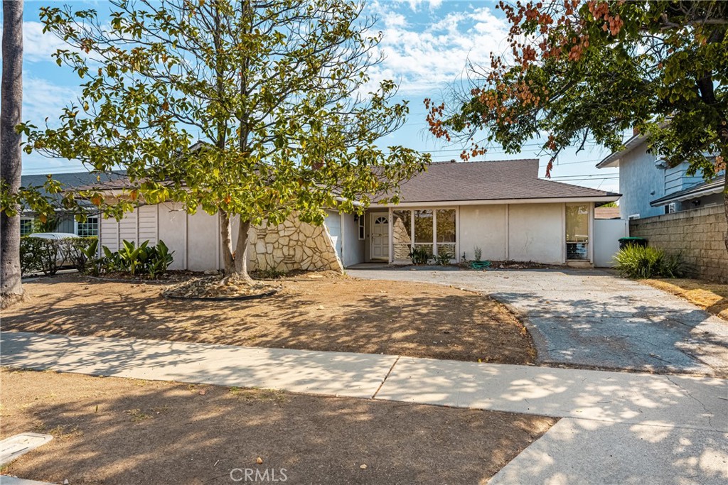 Charming 4-Bedroom, 3-Bathroom Fixer-Upper with Unlimited Potential in Central Orange! Welcome to this spacious and highly sought-after fixer-upper in a prime Central Orange location. This home offers the perfect canvas for the next buyer or investor looking to put their personal touch on a classic floor plan, being sold by the original owners. With great bones and endless possibilities, this property is an incredible opportunity! Step inside to discover a generous floor plan, featuring 3 bedrooms (including a primary suite) and 2 bathrooms on the main level. The primary bedroom boasts views of the rear yard and includes an attached 3/4 bath with a shower. The two additional main floor bedrooms are well-sized and share a guest bath with a tub/shower combo. At the heart of the home, the kitchen features rich wood cabinetry, hard surface counter-tops, and tile flooring. The adjacent formal dining room provides the perfect setting for family meals and gatherings. The rear living room is highlighted by a picture window overlooking the private covered patio and shaded backyard, offering a serene outdoor retreat. A separate family room with a stone fireplace, vaulted wood beam ceilings, and wood wainscoting adds character and warmth to the home. **A Bonus Second Story** The unique floor plan includes a second story addition that can be used as a 4th bedroom, bonus room/game room, or even a multi-generational living space. Featuring double closets, high ceilings, and its own 3/4 bath with a shower, this area also has its own private rear entrance—making it ideal for a teen retreat, guest suite, or home office. The rear yard with a shaded covered patio, mature fruit trees, and plenty of space to create your own private oasis offers endless possibilities with just a little work. An attached 2-car garage with direct access to the home includes laundry hookups. Some windows have already been replaced with vinyl windows for added efficiency. This home is located in one of Orange’s most desirable neighborhoods, just moments from Handy Park, Handy Elementary School, as well as a variety of shopping and dining options. This home is priced to sell As-Is, reflecting the work needed to restore it to its full potential. Whether you are looking to renovate and personalize or take on an investment project, this property offers great bones and a flexible floorplan, just waiting for your vision to bring it back to its former glory. Hurry, this one will go FAST!