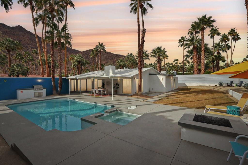 **Move in ready and fully furnished Annual Lease** Completely remodeled and reimagined, mid-century stunner, in Vista Las Palmas! Positioned for the greatest views in VLP on acclaimed Rose Avenue, this Alexander has it all. New 36''x36'' tile flooring, new walnut cabinetry, new light fixtures and recessed lighting, tongue and groove ceilings, all new glazing, new showers, new free standing tub, new doors, new roof, new smooth coat stucco, new paint, new A/C... everything is new! Enter through a custom pivot front door into a vestibule leading either to the kitchen or living room. Kitchen features professional Kitchen Aide appliances, and a paneled Dacor refrigerator, walnut cabinets and pantry, quartz counters, designer backsplash, and perfectly configured open, peninsula layout. Living room offers walls of glass, new sliding doors and tiled, original Alexander fireplace. All bedrooms are en suite with oversized, designer tiled, showers, floating vanities, and designer light fixtures. Primary suite offers and oversized bedrooms with pendant lights on either side of the bed, dual heads in the shower with shower wands, freestanding soaking tub, dual vanities, and access to the backyard. Resort style back yard offers newly designed, plastered, and tiled pool/spa with new acid washed concrete decking. Built in bbq with concrete countertops, covered patio, built in fire pit and huge mountain views in every direction.