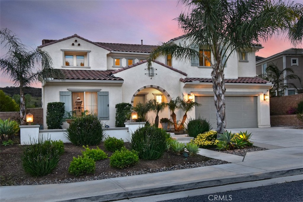 Seller is willing to pay lender 2-1 rate buy down for the buyer! This luxurious home in the prestigious Sterling at West Hills Community is the perfect blend of elegance, comfort, and modern living. With breathtaking mountain views, it truly offers a private oasis. Boasting 5 bedrooms, 6 bathrooms, and a sprawling 4,015 square feet of living space, every inch of this home has been designed with exquisite taste and attention to detail. The main level welcomes you with a flexible office/den space, a powder room, and a formal dining room, setting the tone for a sophisticated living experience. The spacious living room features retractable sliding doors, effortlessly connecting the indoor space to the stunning backyard—ideal for entertaining. The backyard is a dream, with a sparkling pool, relaxing spa, built-in BBQ area, and cozy fire pit, creating the perfect atmosphere for gatherings. The chef’s kitchen is a culinary masterpiece, complete with an oversized island, high-end stainless-steel appliances, quartz countertops, and a large pantry. Additionally, through the kitchen is a mudroom which leads directly to a three-car garage for added convenience. The main level also features a luxurious primary suite, complete with its own washer and dryer, a spa-like bathroom, and a generous walk-in closet. Upstairs, you’ll find a spacious loft, laundry room, and four additional bedrooms, one of which has been transformed into a gym, along with four bathrooms. This home is the epitome of luxury, designed for those who seek style, convenience, and the ultimate California lifestyle. It’s truly a must-see property for those in search of the perfect home.