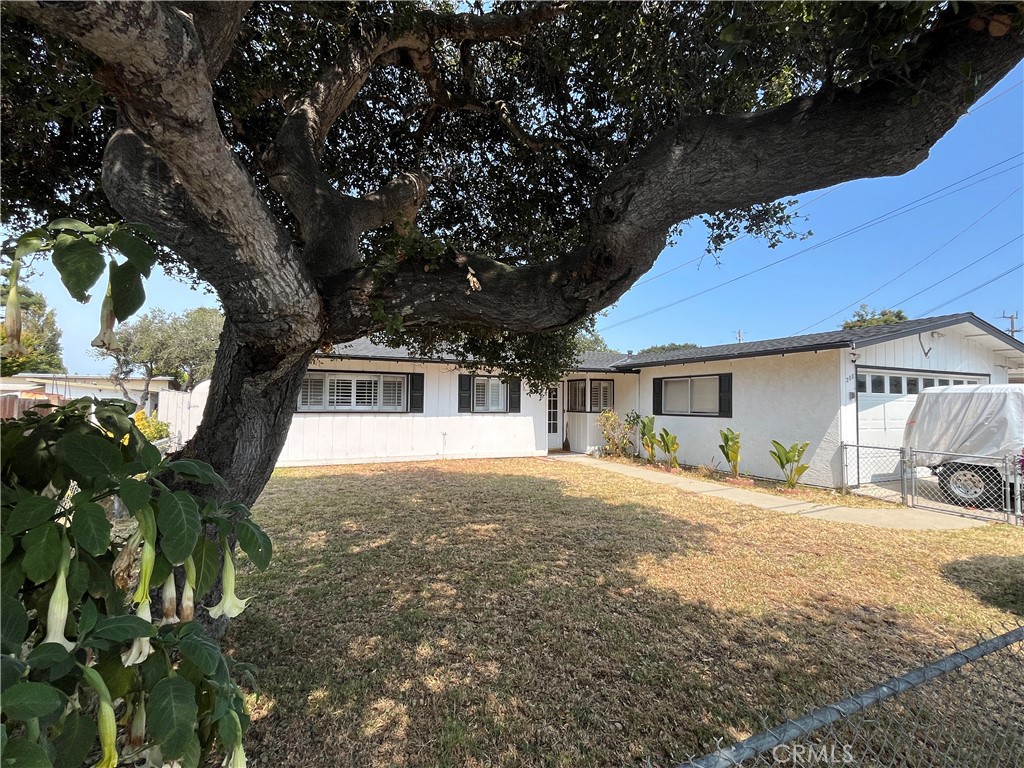 Opportunity knocks in Arroyo Grande! This well loved 3 bed/2 bath 1391sf home is the one you've been waiting for! Walking through the entry you are greeted by the dining room with plantation shutters and updated tile flooring with custom inlays. Adjacent the dining room is the kitchen where that same updated tile flooring continues. Take a load off in the fantastic living room with it's vaulted and exposed beam ceiling with ship lap finish, offering plenty of breathing room for even your tallest guests, updated with laminate plank flooring. Escape through the french doors to the enclosed patio/sunroom where your plants will thrive, you can enjoy the indoor/outdoor setting, and access the patio and backyard via the sliding door. The 7250sf lot affords a sizeable backyard complete with a BBQ island, storage shed, and a shipping container for even more storage! Back inside the primary suite offers a tasteful paint scheme with plantation shutters, newer carpet, and a curbed entry shower. The 2 guest bedrooms offer that same vaulted and beamed ceiling from the living room. Whoa hang on! I almost forgot to mention the roof is new and the water heater has been replaced, as have the toilets! I have a feeling this one won't last long......
