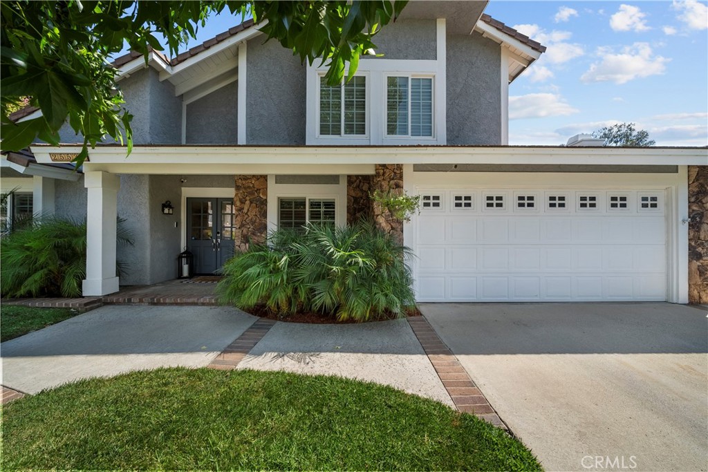 You’re going to LOVE this fantastic four-bedroom, three-bathroom home in one of Valencia’s most desirable neighborhoods, "Behind Granary Square". It is set at the end of a cul-de-sac surrounded by mature trees and just steps from the paseos and Almendra Park. Remodeled in 2020, it features a light and bright open concept kitchen with quartz countertops, stainless steel appliances, a huge breakfast bar for seating, a large garden window overlooking the backyard, and extensive cabinetry with large pull-out drawers, plus newer flooring, updated bathrooms, and soaring high ceilings that fill the home with natural light. The floor plan includes a downstairs bedroom and full bath, spacious living areas, and upstairs, three bedrooms and two full bathrooms. The backyard is perfect for both relaxation and play with a fire pit, jacuzzi, and patio area. Recent energy-efficient upgrades include HVAC system, ducting, dual-pane windows, whole-house fan, and water heater. The HOA is amazing with its low monthly dues and 3 community pools/spas. "Behind Granary Square" is Valencia living at its best with miles of paseo walking trails, award-winning schools, and nearby shopping, dining, and freeway access—all with a low HOA and no Mello Roos!