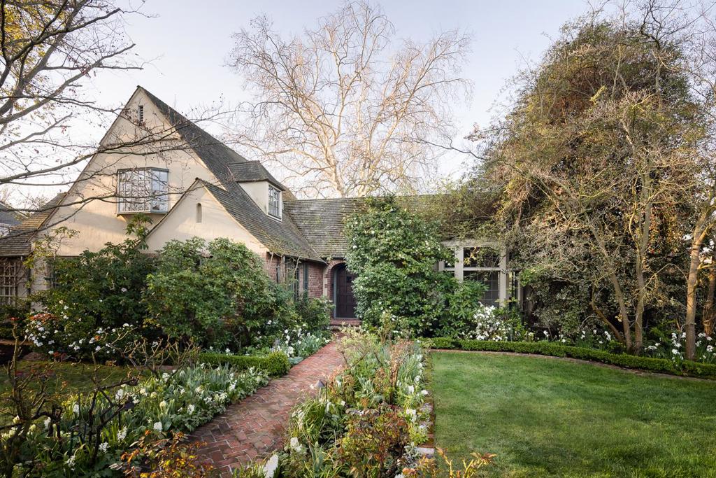 Commanding corner lot with stunning garden hints at the interior beauty of this classic Crescent Park home. Meandering brick paths in the established garden are bordered by beds bursting with greenery & blossoms creating a magical year-round display of seasonal hues & textures. An intimate courtyard provides a delightful dining option & a sprawling brick patio beneath a majestic sycamore is perfect for outdoor enjoyment. There are 2 main-level bedrooms & 3 upper bedrooms, each with bath. Detached 2-car garage with studio/office.